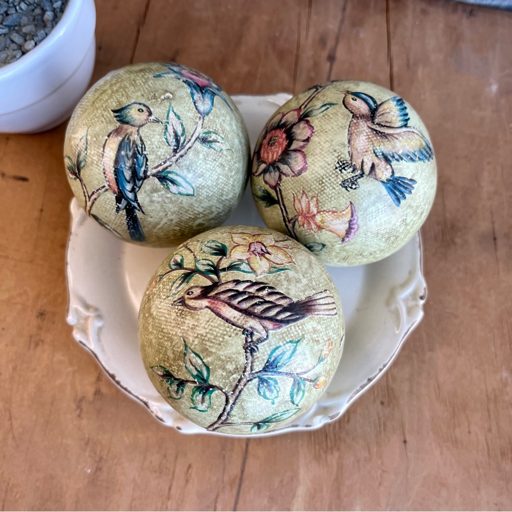 Three Decorative Orbs with Botanical and Bird Graphics.